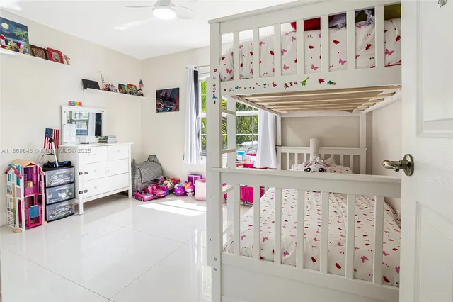 a view of a hallway with stairs and toys