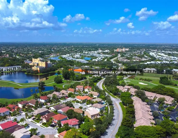 an aerial view of a houses with outdoor space