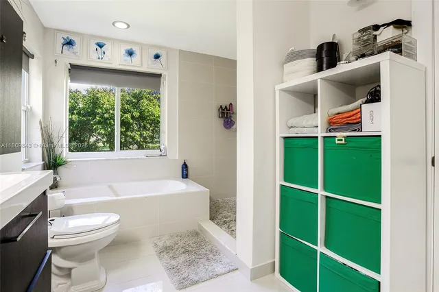 a bathroom with a toilet a sink and a bathtub