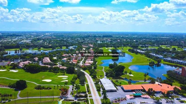 a view of a city with lots of flower and trees