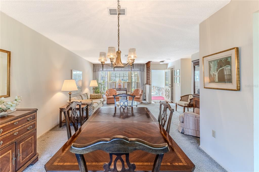 2193 Timber Lodge Lane Spring Hill, FL 34606 - Photo 16 of 73 a view of a dining room with furniture window and wooden floor