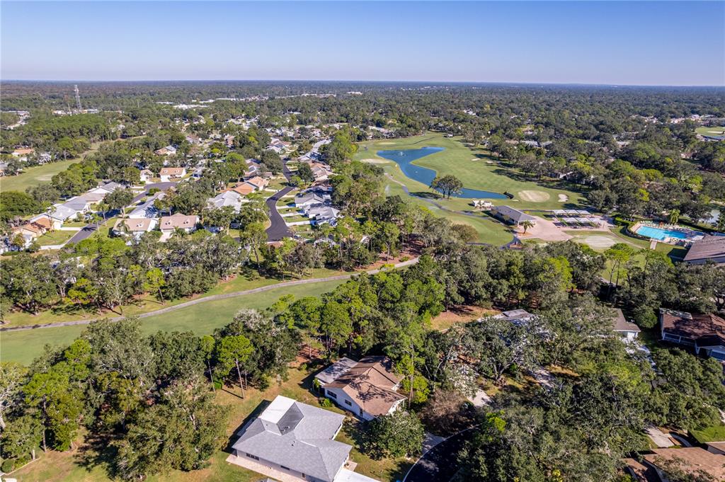 2193 Timber Lodge Lane Spring Hill, FL 34606 - Photo 17 of 73 an aerial view of a houses with a lake view