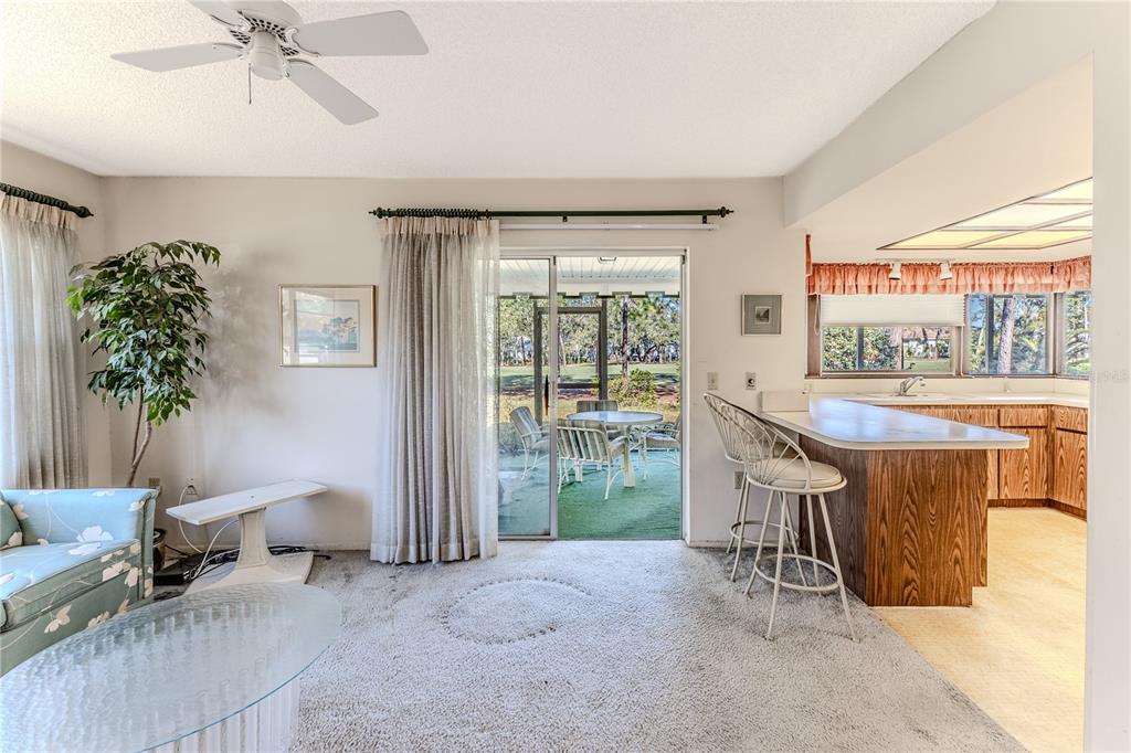 2193 Timber Lodge Lane Spring Hill, FL 34606 - Photo 26 of 73 a living room with furniture and a large window