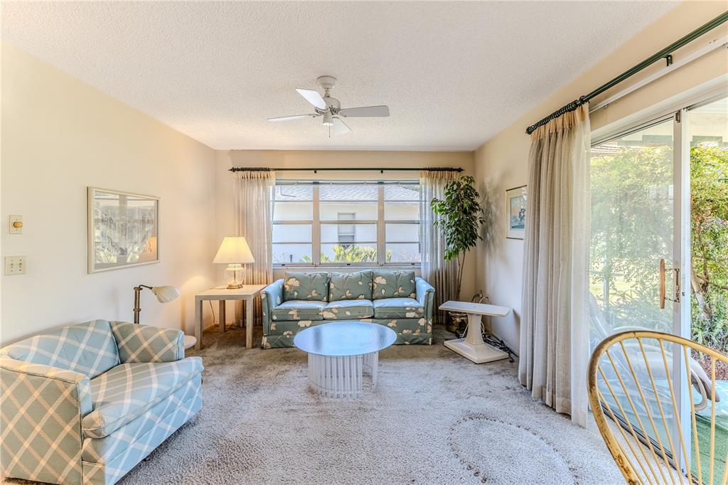 2193 Timber Lodge Lane Spring Hill, FL 34606 - Photo 27 of 73 a living room with furniture and a large window