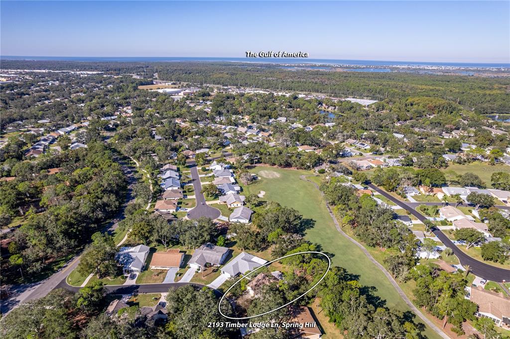 2193 Timber Lodge Lane Spring Hill, FL 34606 - Photo 3 of 73 an aerial view of residential building and lake