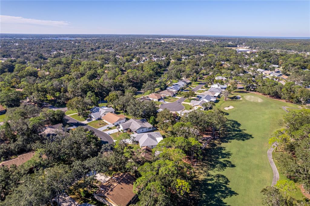 2193 Timber Lodge Lane Spring Hill, FL 34606 - Photo 35 of 73 an aerial view of residential house with outdoor space and lake view