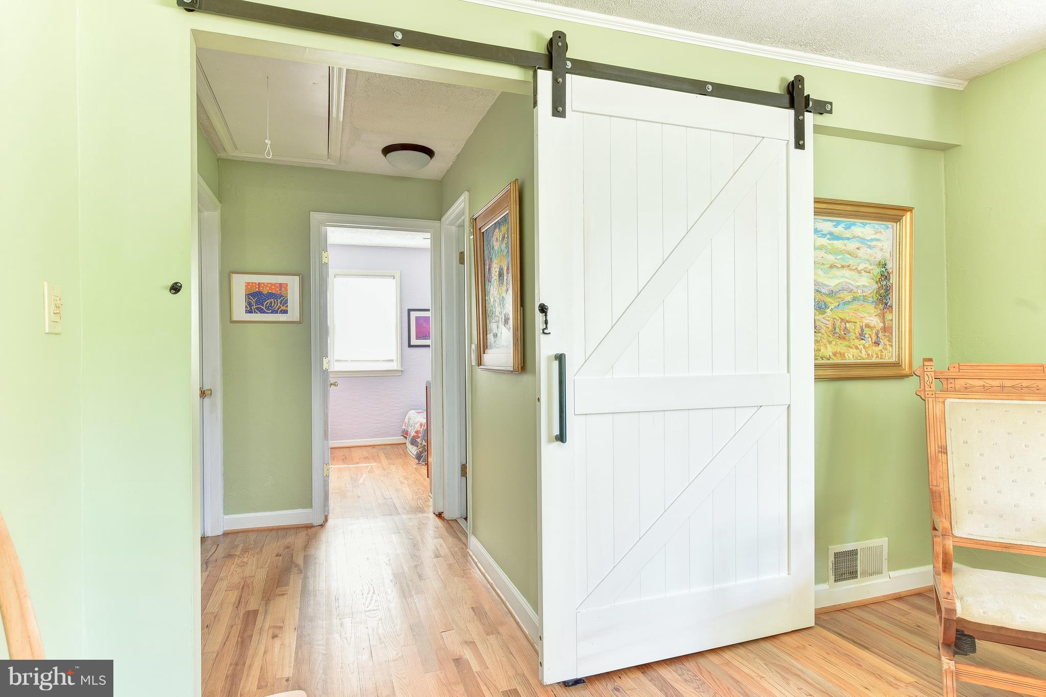 7923 Jackson Road Alexandria, VA 22308 - Photo 10 of 33 Custom made Barn door creates privacy for bedrooms