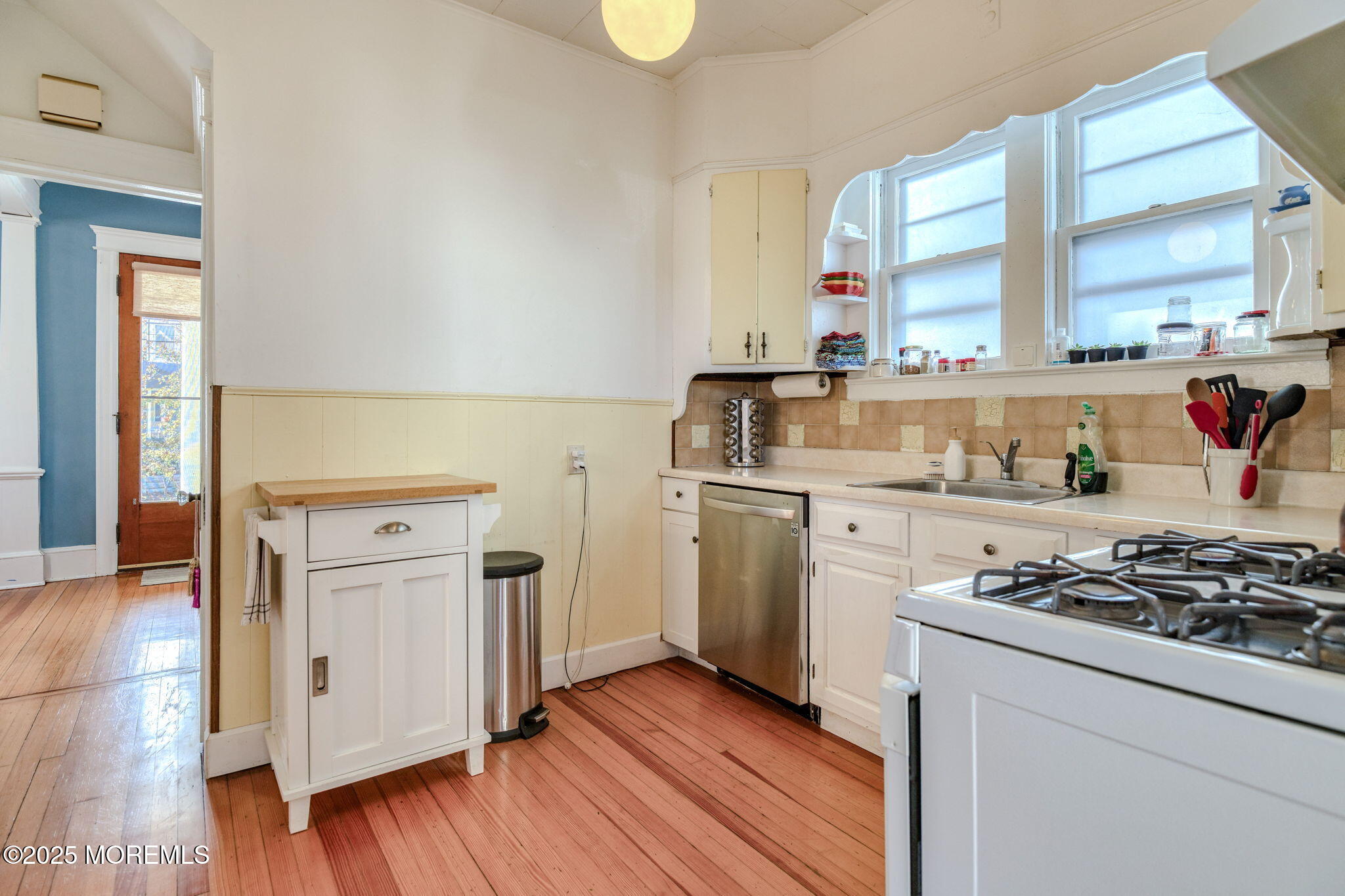139 Cookman Avenue Ocean Grove, NJ 07756 - Photo 17 of 58 a kitchen with white cabinets and appliances