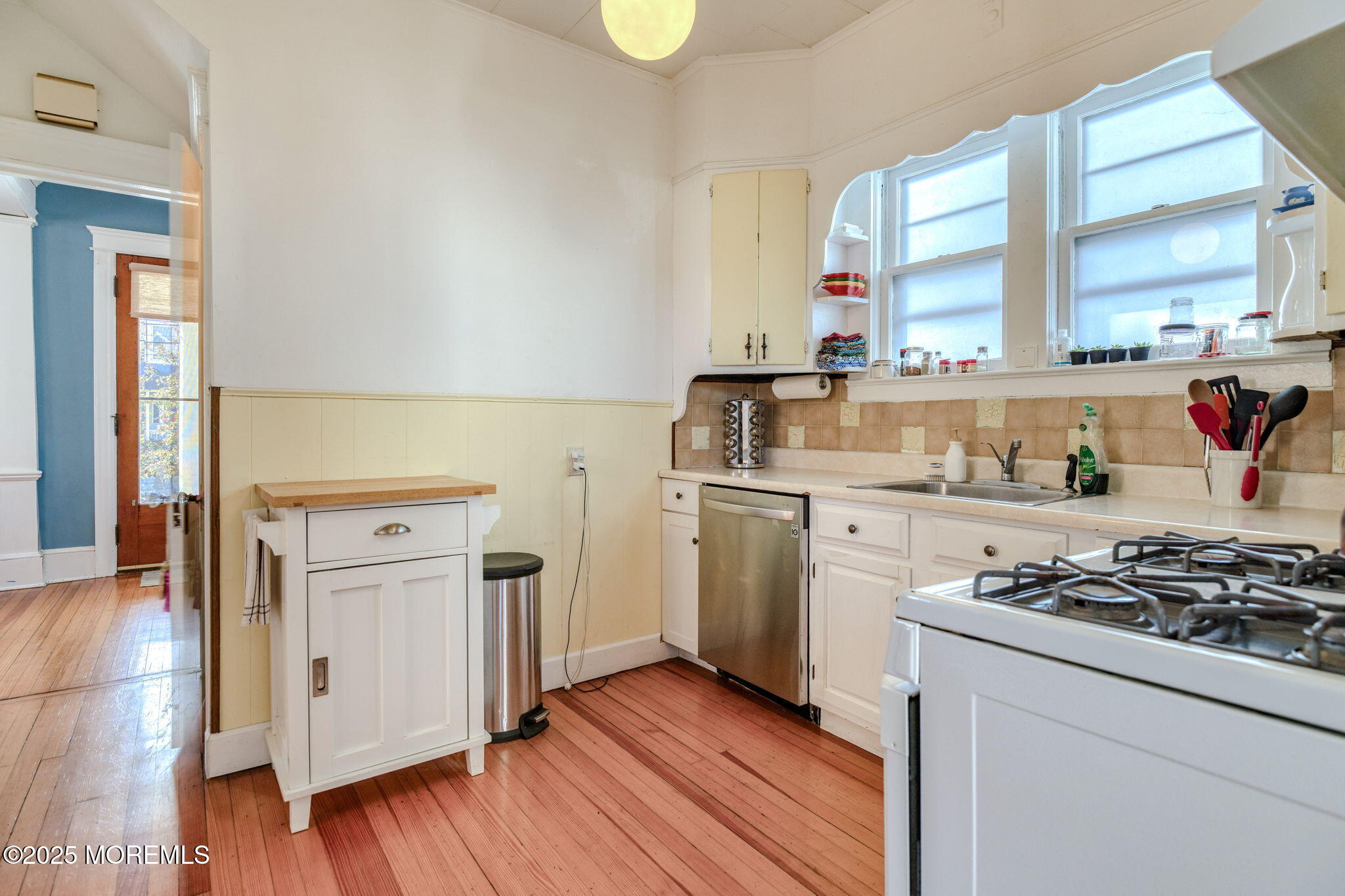 139 Cookman Avenue Ocean Grove, NJ 07756 - Photo 20 of 58 a kitchen with white cabinets and appliances