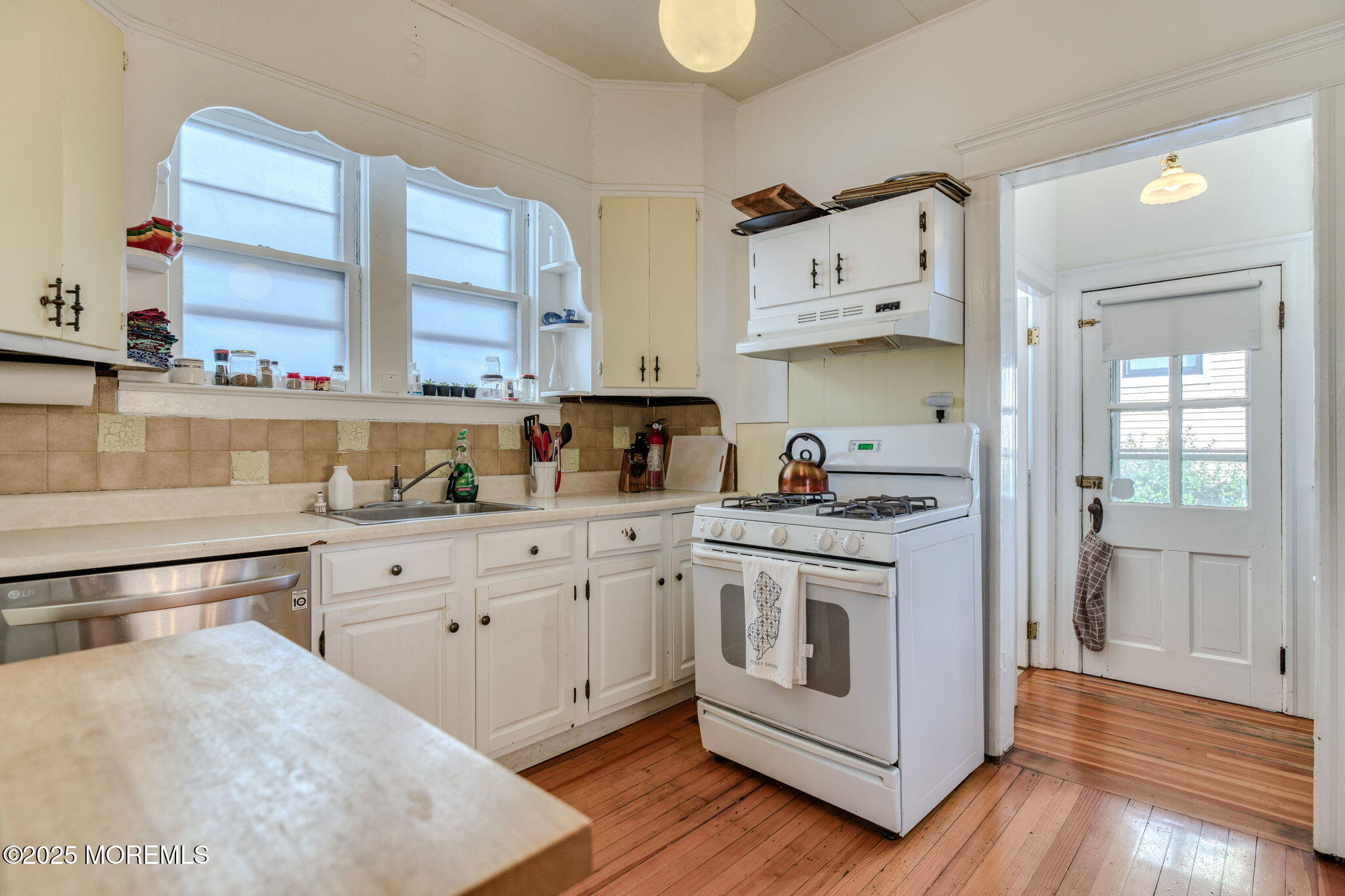 139 Cookman Avenue Ocean Grove, NJ 07756 - Photo 21 of 58 a kitchen with stainless steel appliances granite countertop a stove a sink and a refrigerator