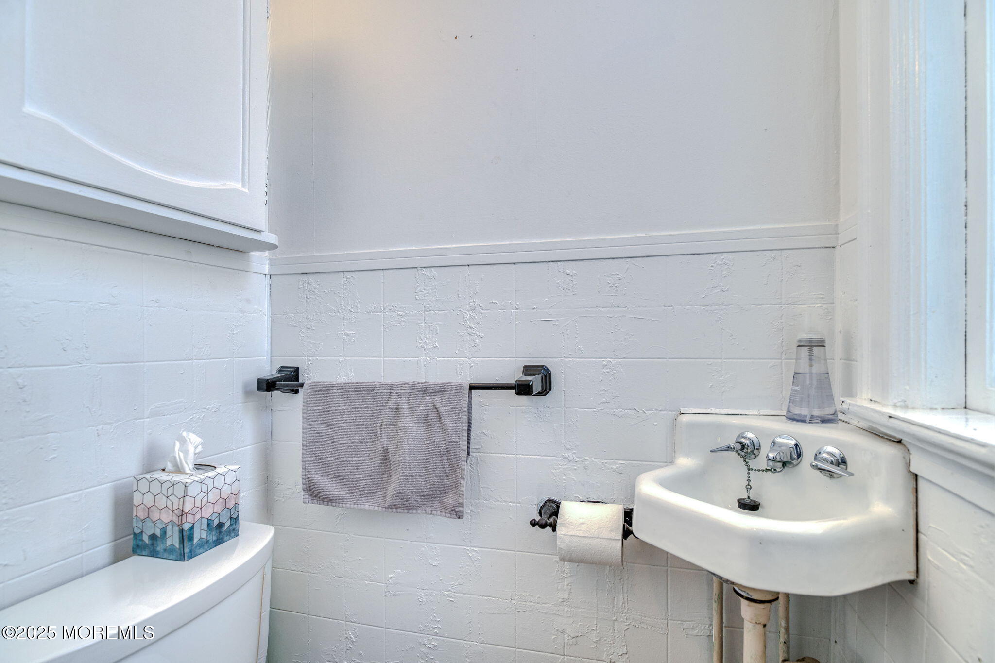 139 Cookman Avenue Ocean Grove, NJ 07756 - Photo 23 of 58 a bathroom with a sink and a mirror