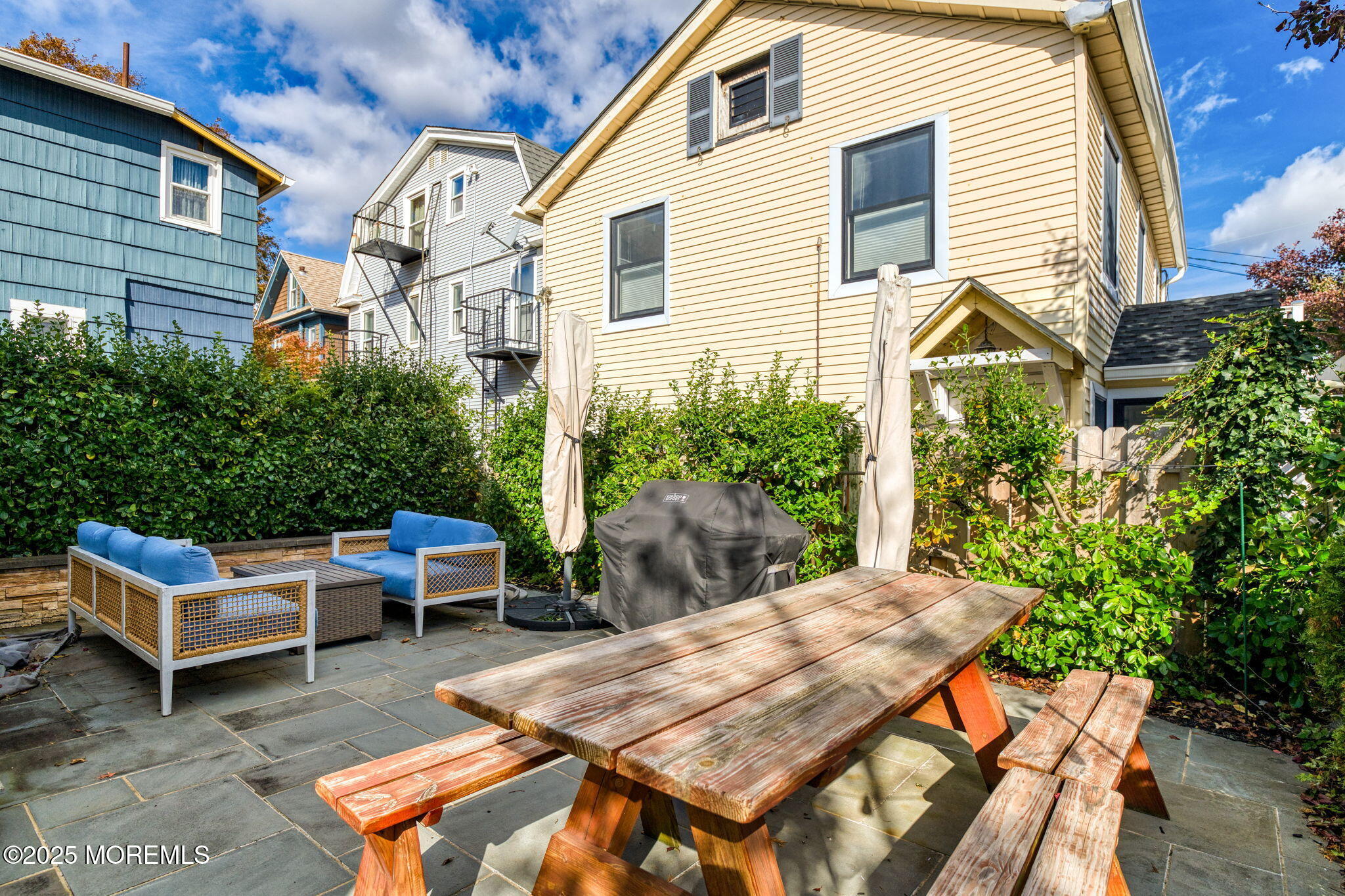 139 Cookman Avenue Ocean Grove, NJ 07756 - Photo 43 of 58 a view of a patio with table and chairs and potted plants