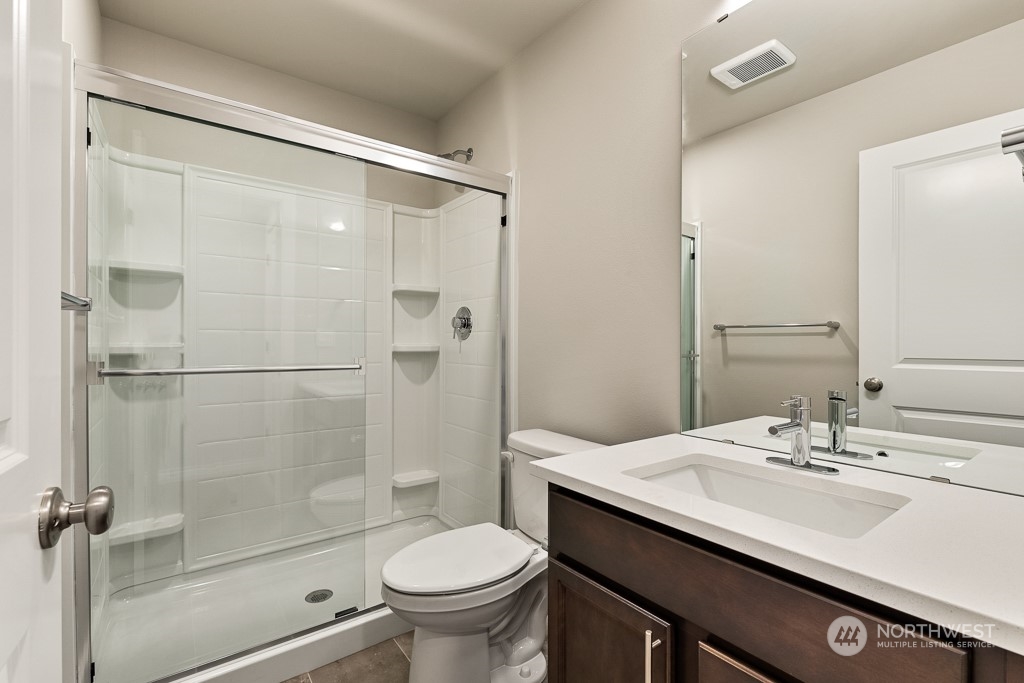 301 207th Place Southeast, Unit EH 31 Bothell, WA 98012 - Photo 6 of 32 a bathroom with a sink toilet and shower