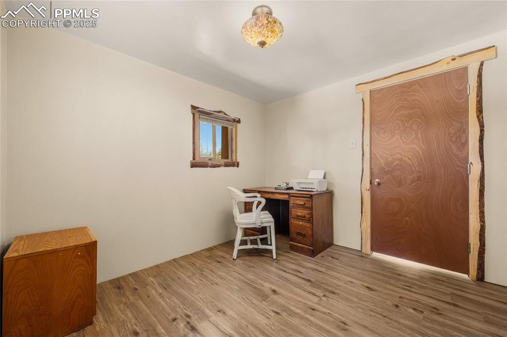 2925 M Path Cotopaxi, CO 81223 - Photo 12 of 27 a view of a workspace with furniture and wooden floor