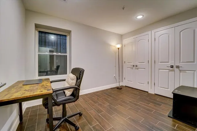 a view of a livingroom with furniture and wooden floor
