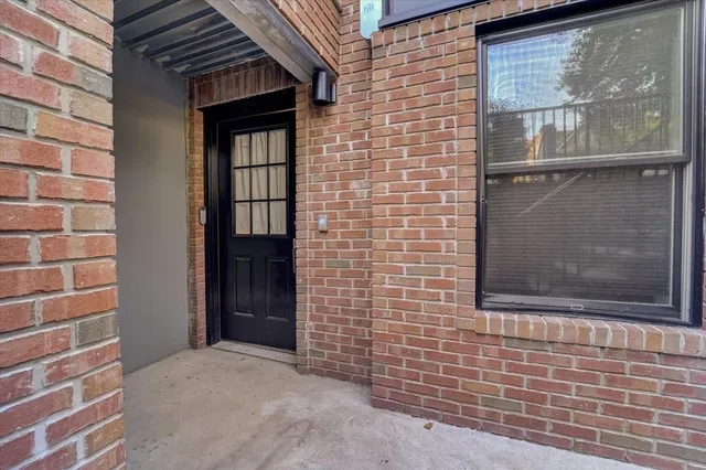 a view of front door of house and window