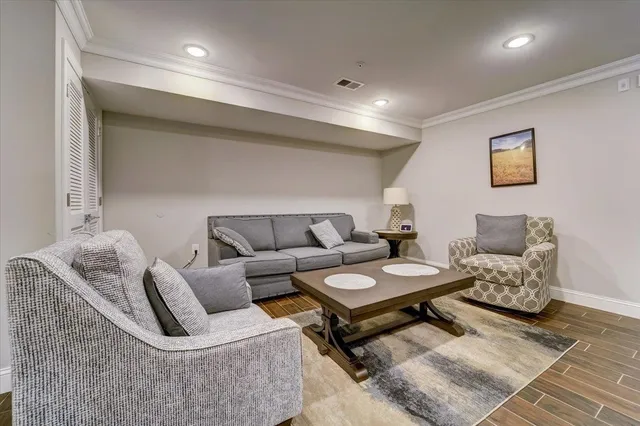 a living room with furniture and a rug