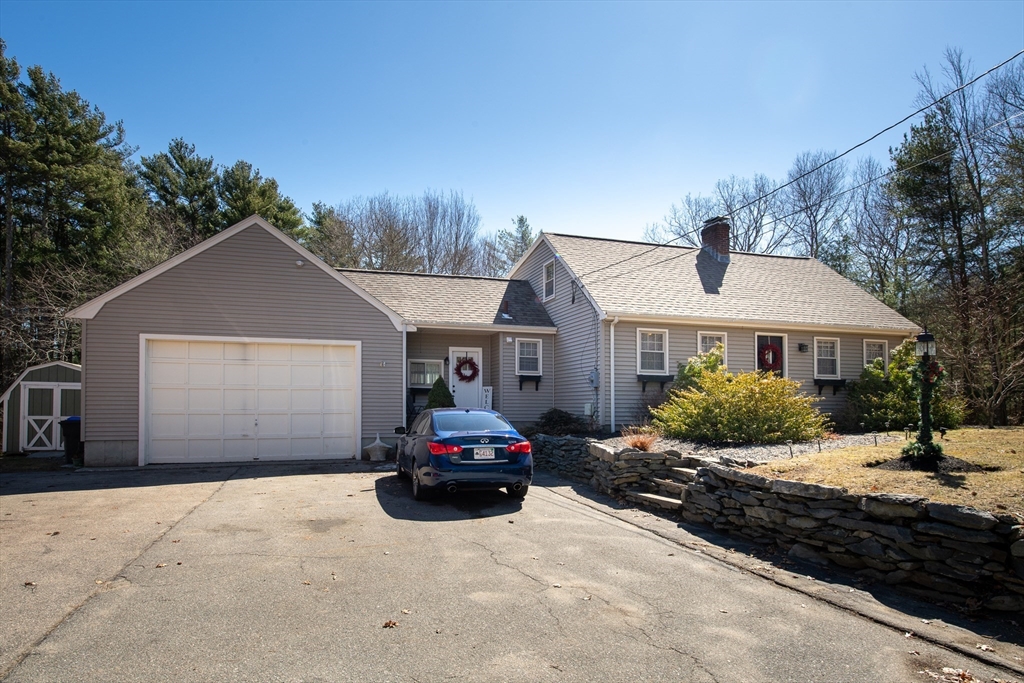 78 Precinct Street Taunton, MA 02718 - Photo 2 of 41 a front view of a house with a yard and garage