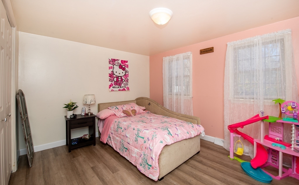 78 Precinct Street Taunton, MA 02718 - Photo 25 of 41 a bedroom with a bed and wooden floor