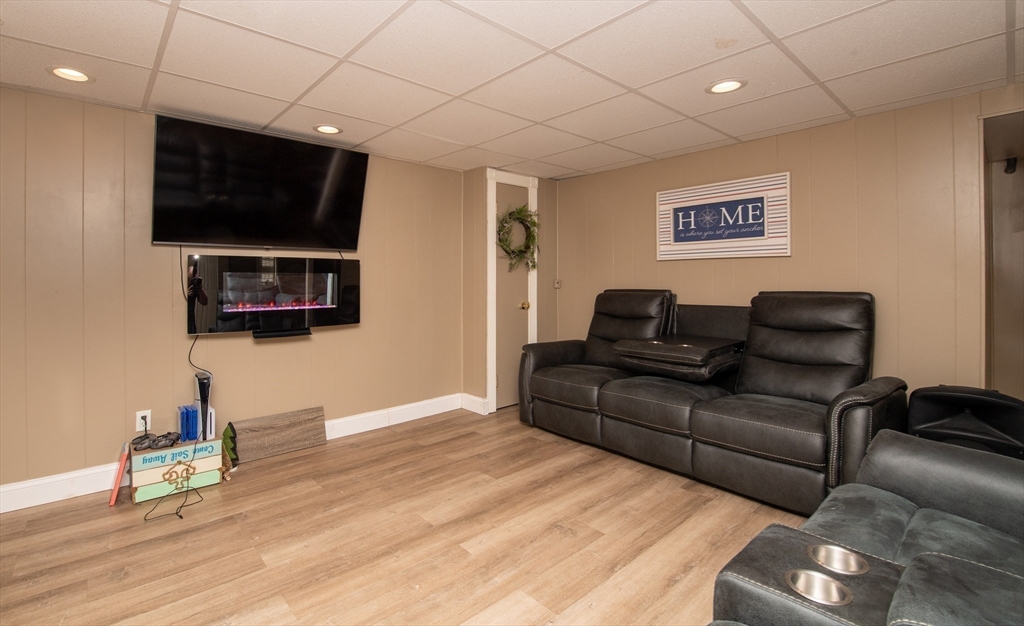 78 Precinct Street Taunton, MA 02718 - Photo 33 of 41 a living room with furniture and a flat screen tv