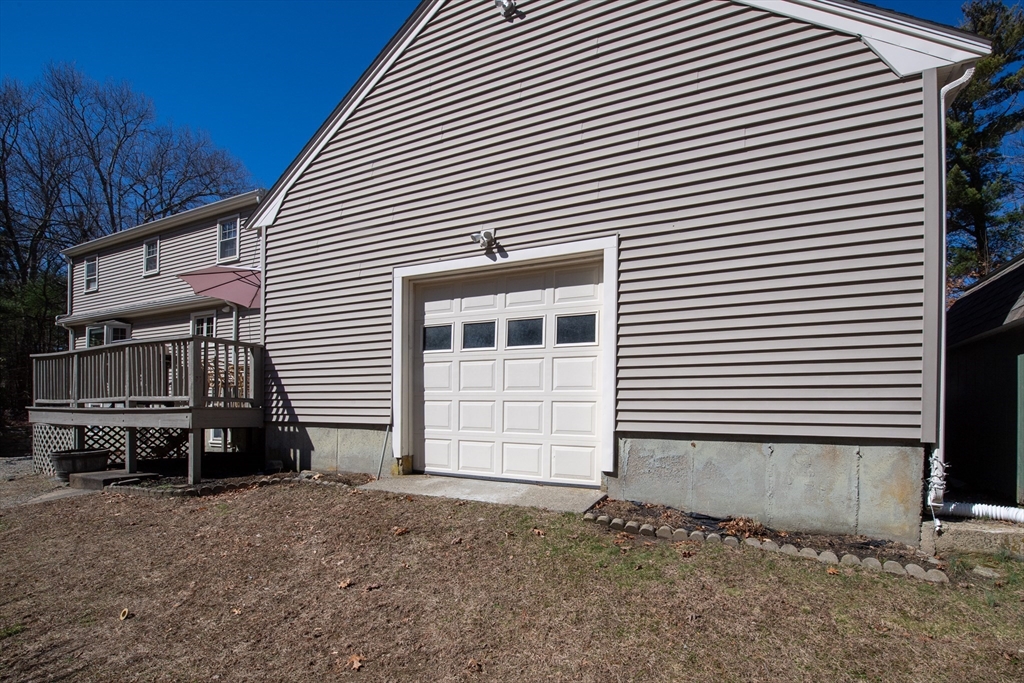 78 Precinct Street Taunton, MA 02718 - Photo 6 of 41 a backyard of a house with barbeque oven and brick wall