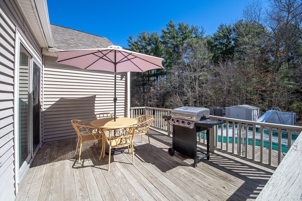 78 Precinct Street Taunton, MA 02718 - Photo 8 of 41 a view of a patio with a table and chairs