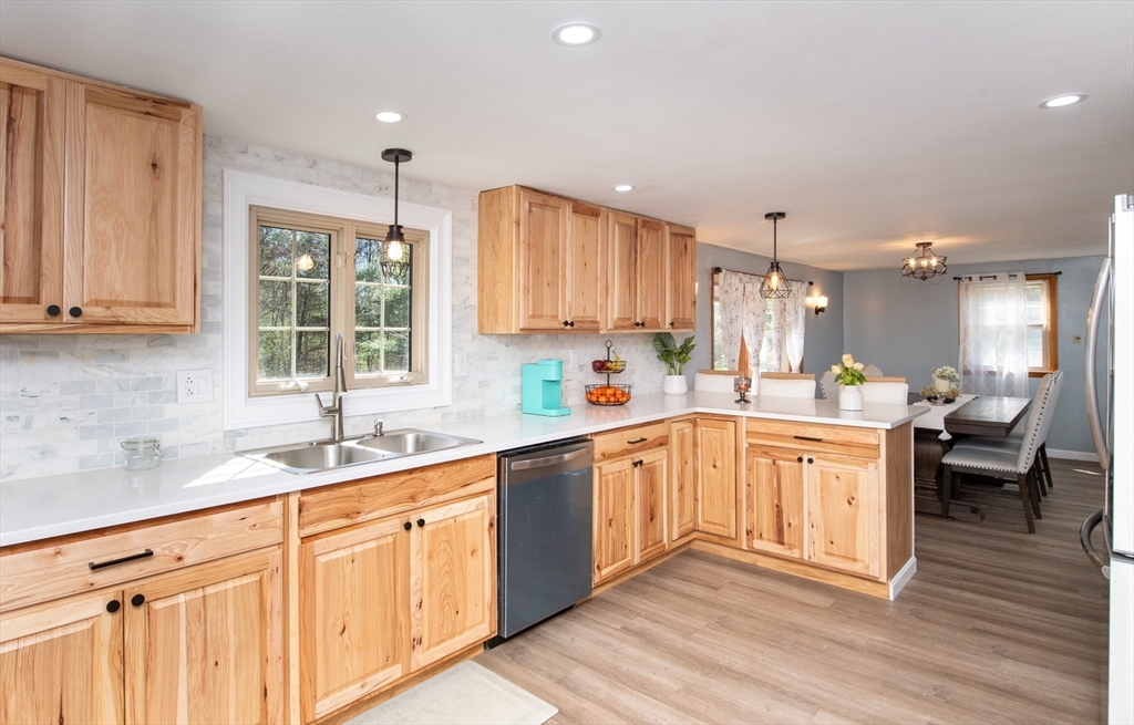 78 Precinct Street Taunton, MA 02718 - Photo 9 of 41 a kitchen with granite countertop white cabinets white appliances and sink