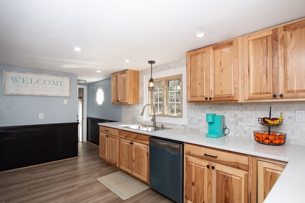 78 Precinct Street Taunton, MA 02718 - Photo 10 of 41 a kitchen with stainless steel appliances granite countertop a sink stove and cabinets