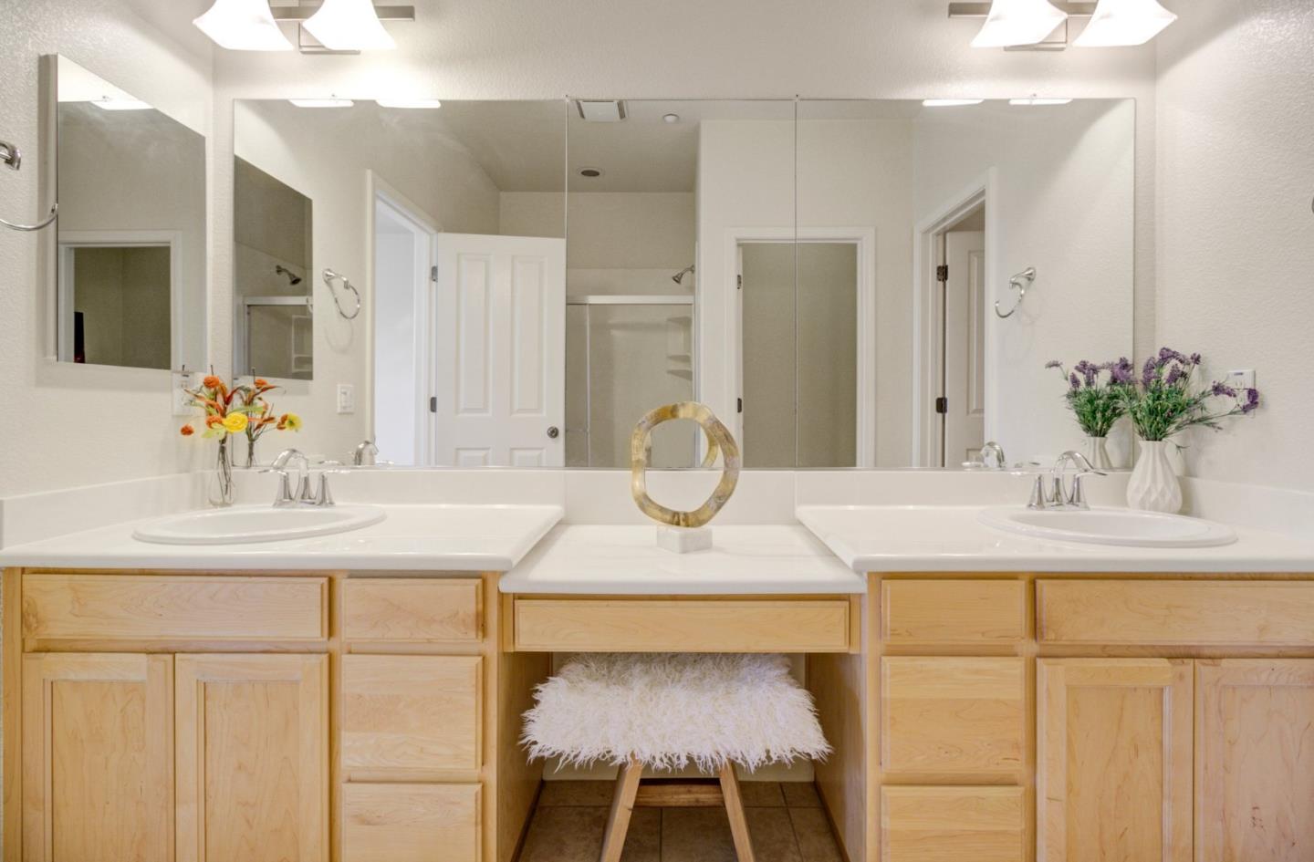 5056 Fioli Loop San Ramon, CA 94582 - Photo 17 of 44 a bathroom with a sink and a mirror