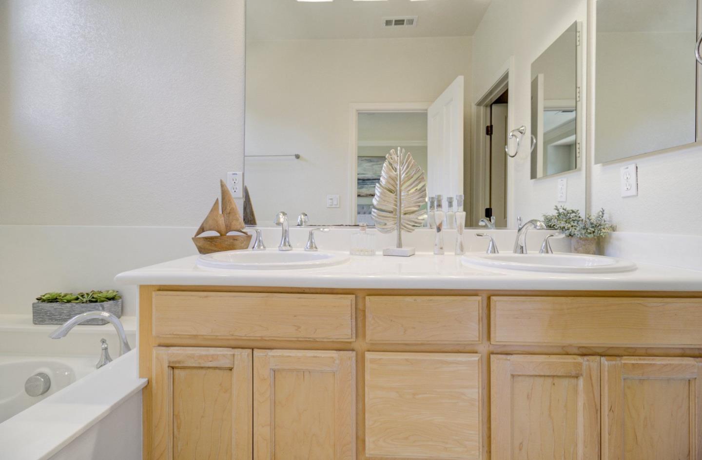 5056 Fioli Loop San Ramon, CA 94582 - Photo 32 of 44 a bathroom with a sink and a mirror