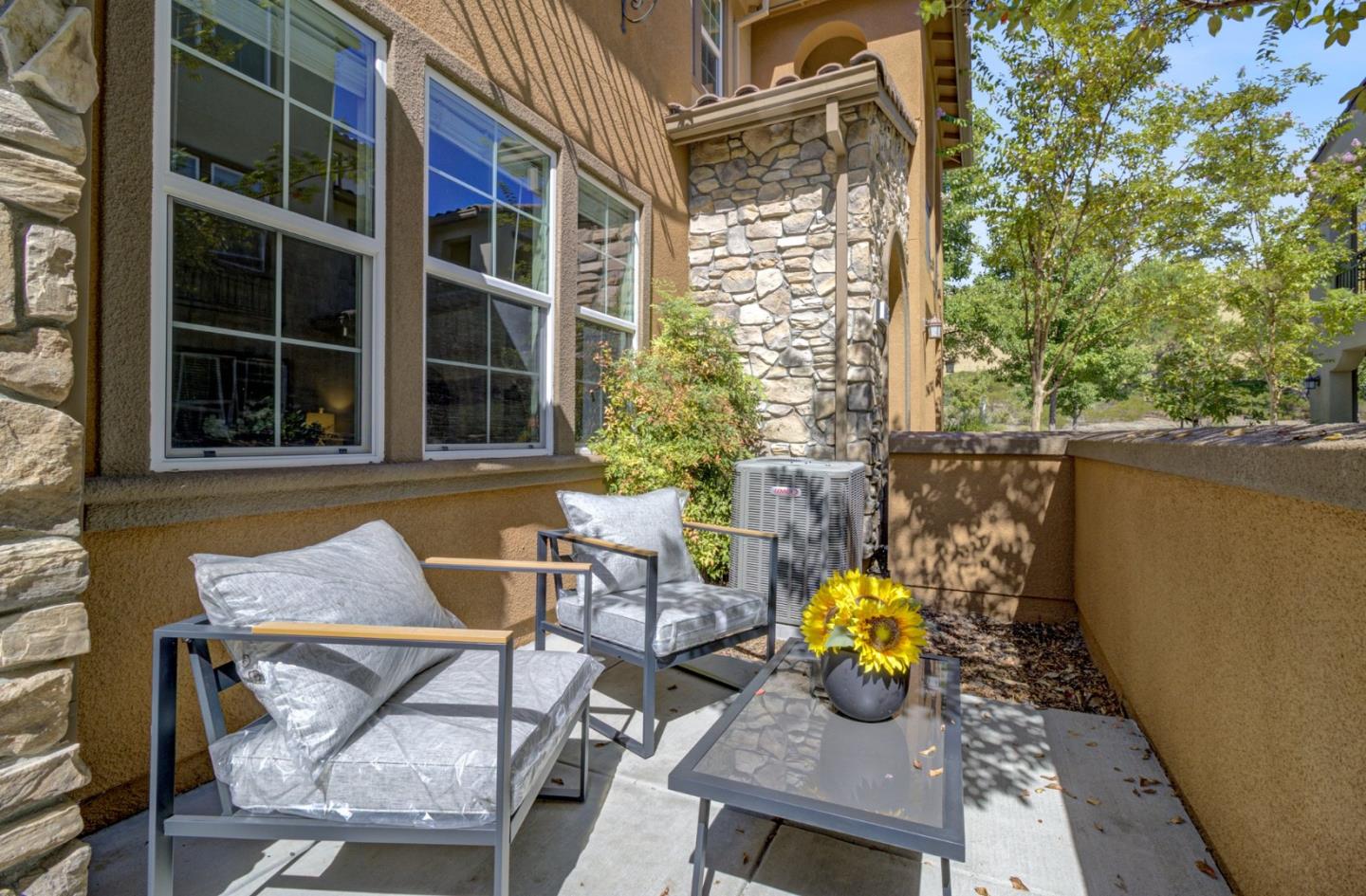 5056 Fioli Loop San Ramon, CA 94582 - Photo 4 of 44 a view of a patio with table and chairs and potted plants