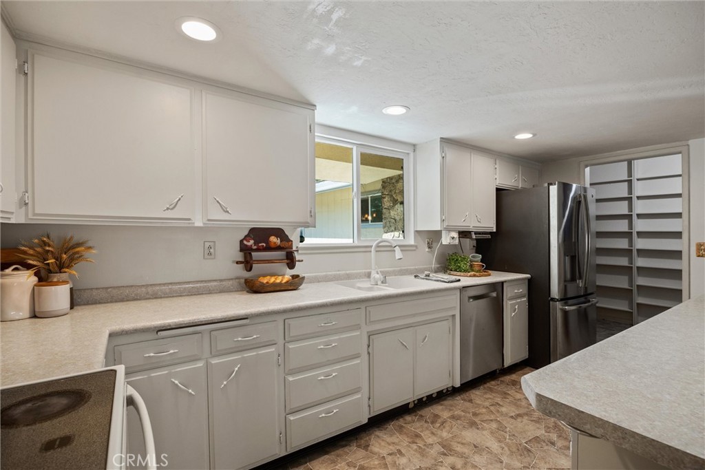 657 Villa Drive Chico, CA 95973 - Photo 12 of 40 a kitchen with a sink and cabinets