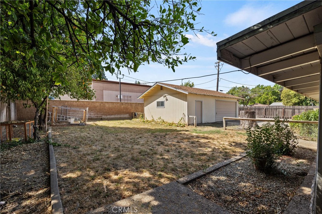 657 Villa Drive Chico, CA 95973 - Photo 39 of 40 a view of a barn house next to a yard with large trees