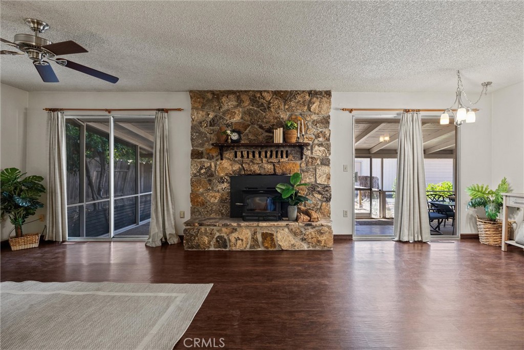657 Villa Drive Chico, CA 95973 - Photo 9 of 40 a view of a living room and a large window with wooden floor