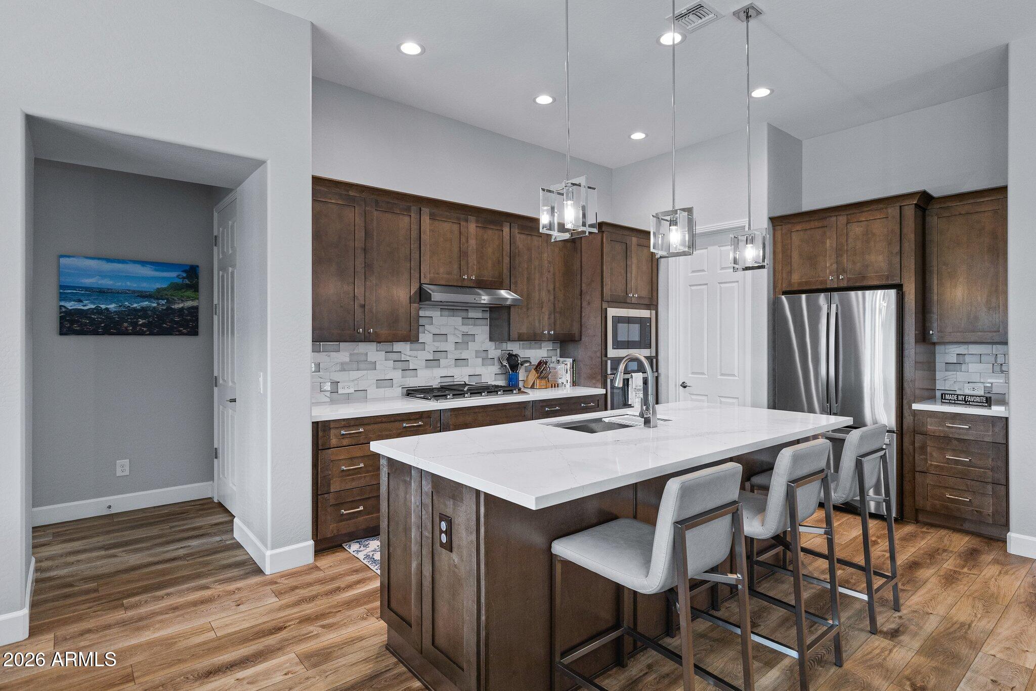16897 West Almeria Road Goodyear, AZ 85395 - Photo 10 of 51 Gourmet Kitchen with Island