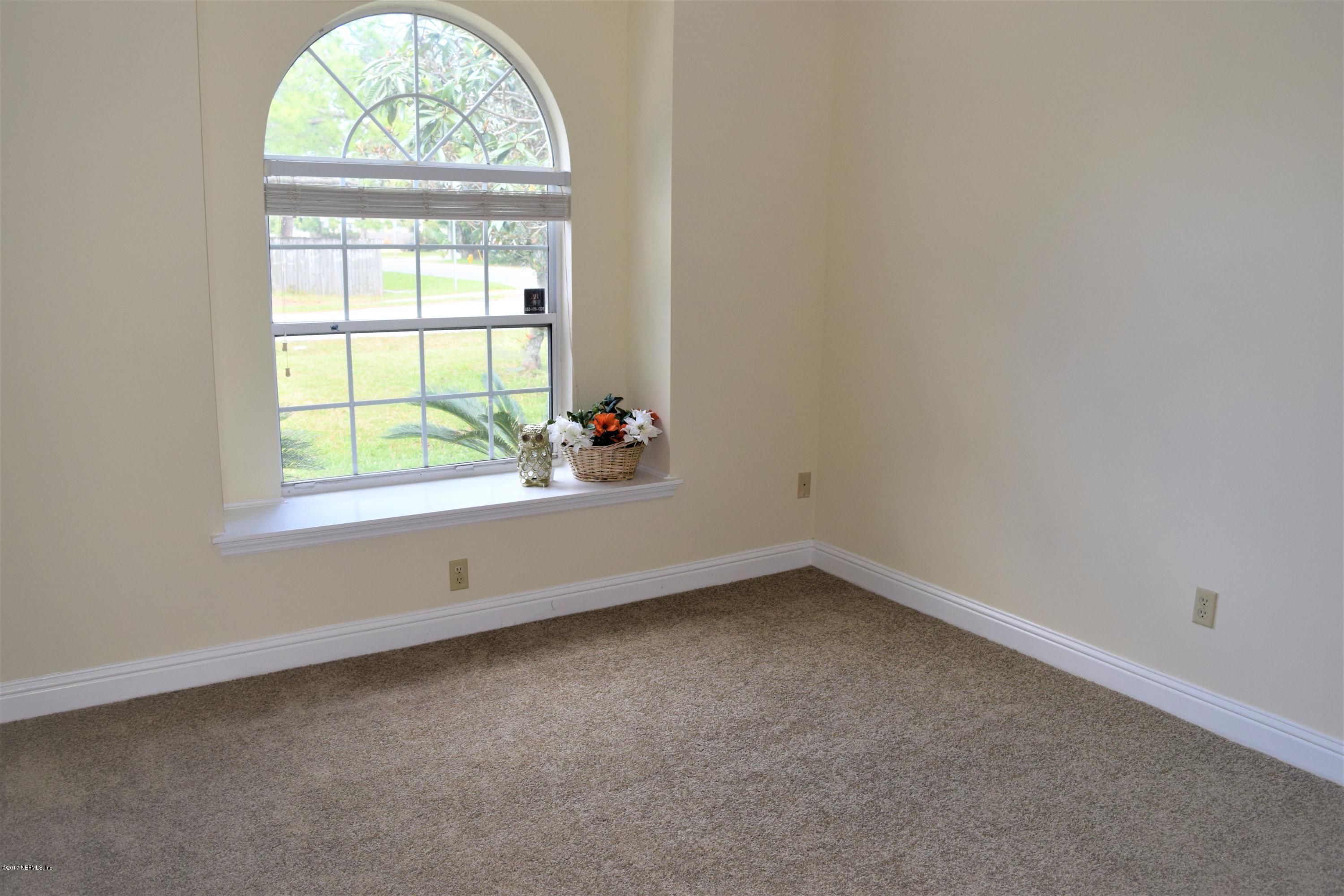 6658 Bennett Road Jacksonville, FL 32216 - Photo 11 of 19 an empty room with a window