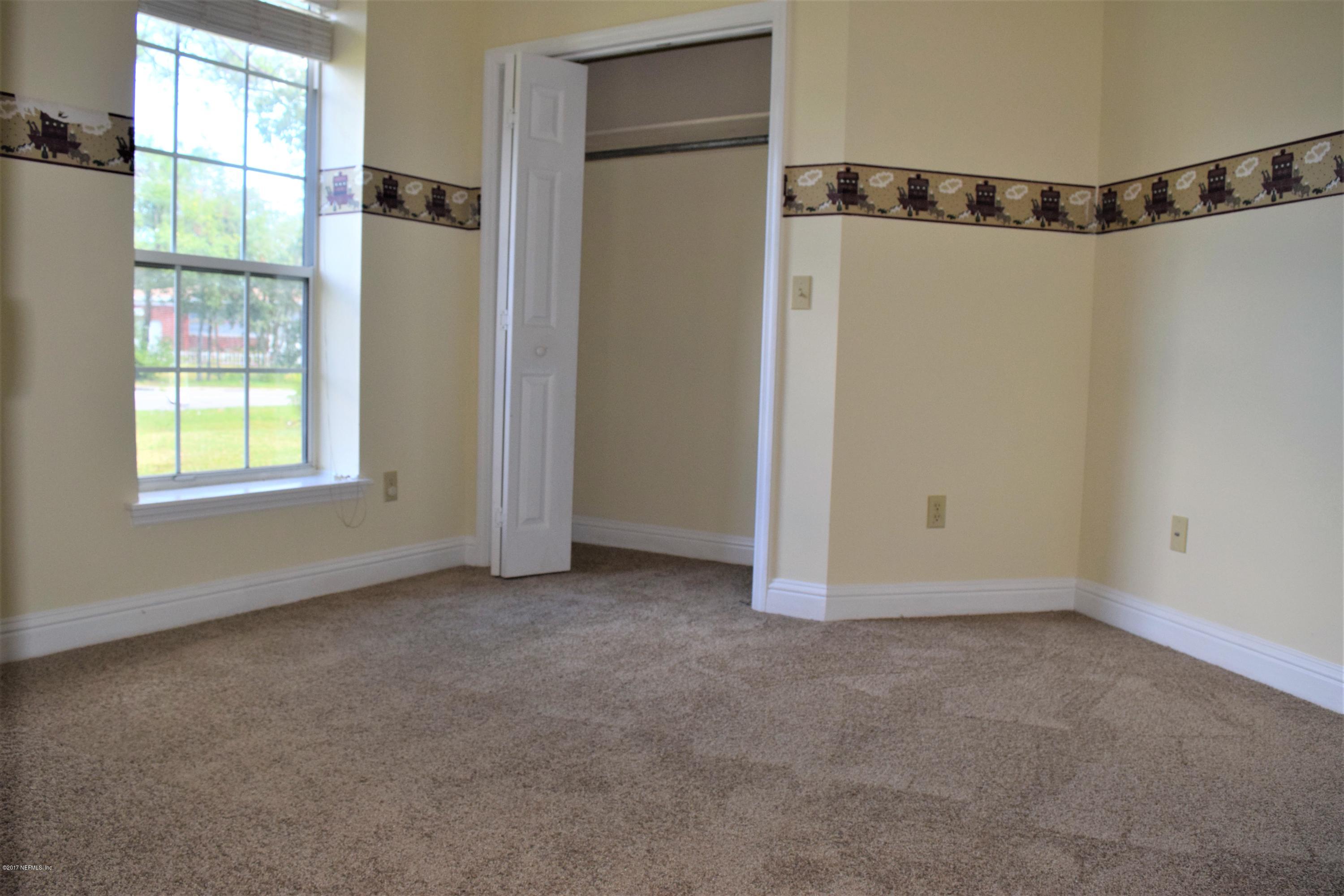 6658 Bennett Road Jacksonville, FL 32216 - Photo 13 of 19 a view of an empty room with a window