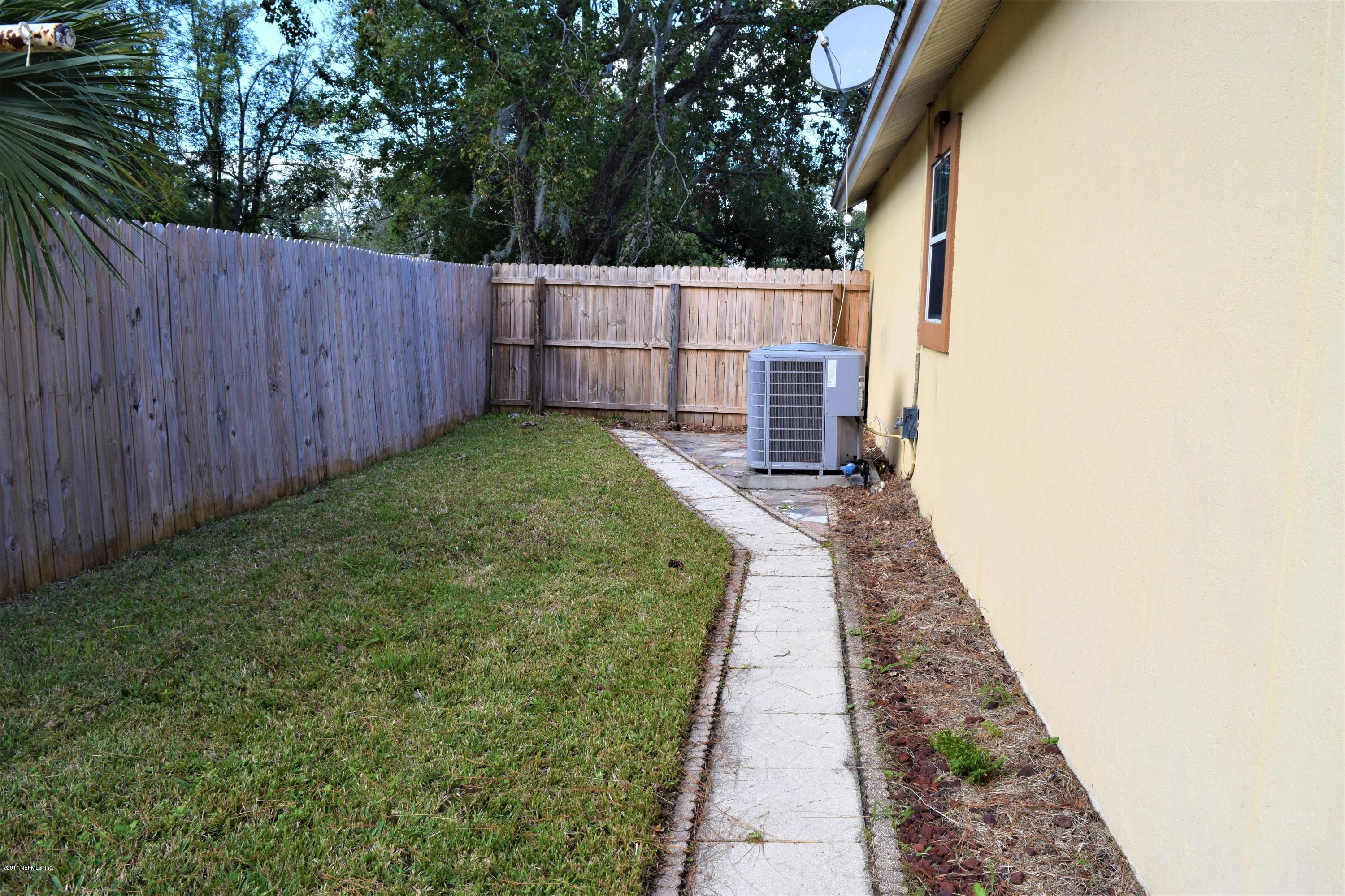 6658 Bennett Road Jacksonville, FL 32216 - Photo 19 of 19 a view of a backyard with pathway