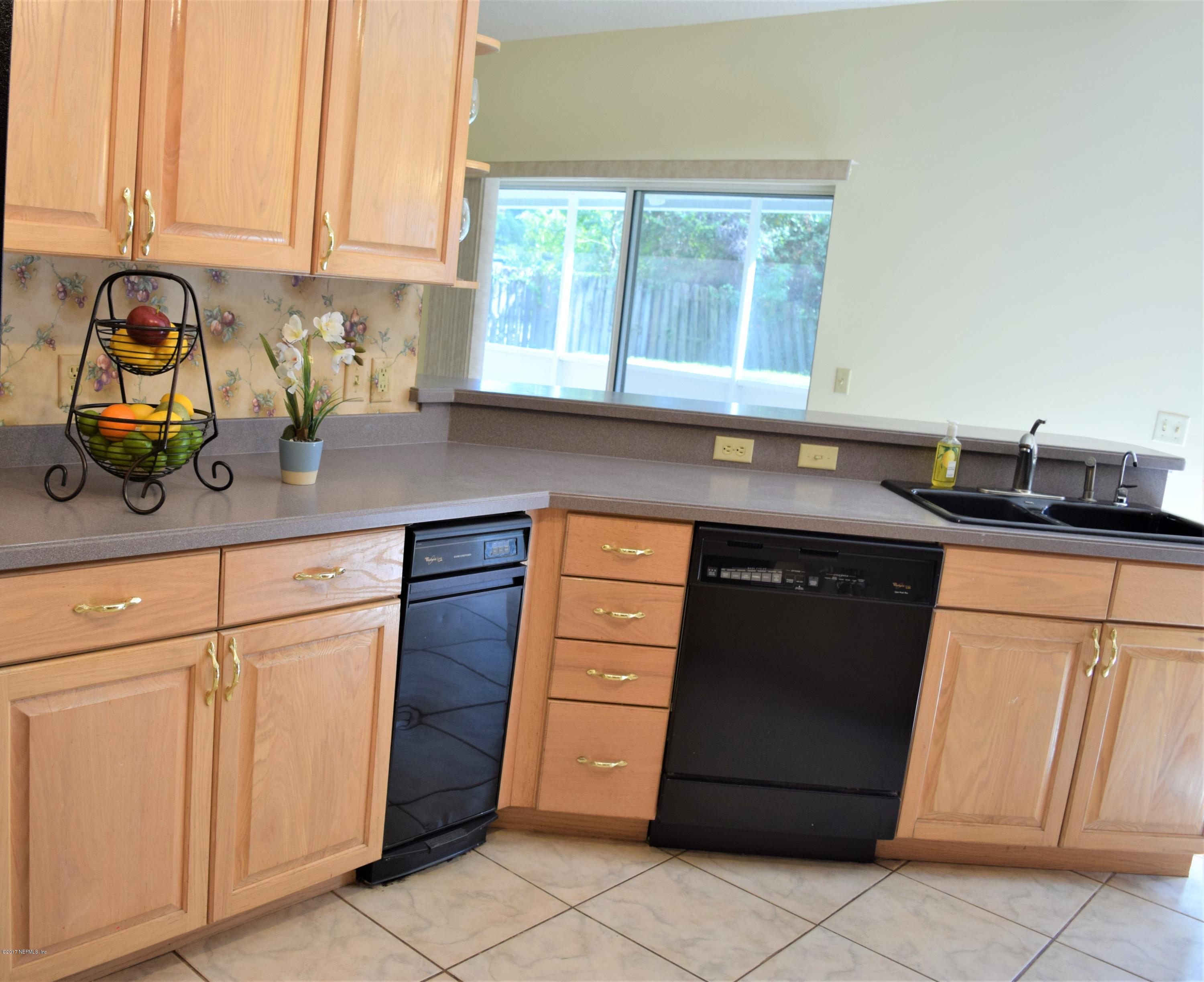 6658 Bennett Road Jacksonville, FL 32216 - Photo 5 of 19 a kitchen with stainless steel appliances granite countertop a sink and a cabinets