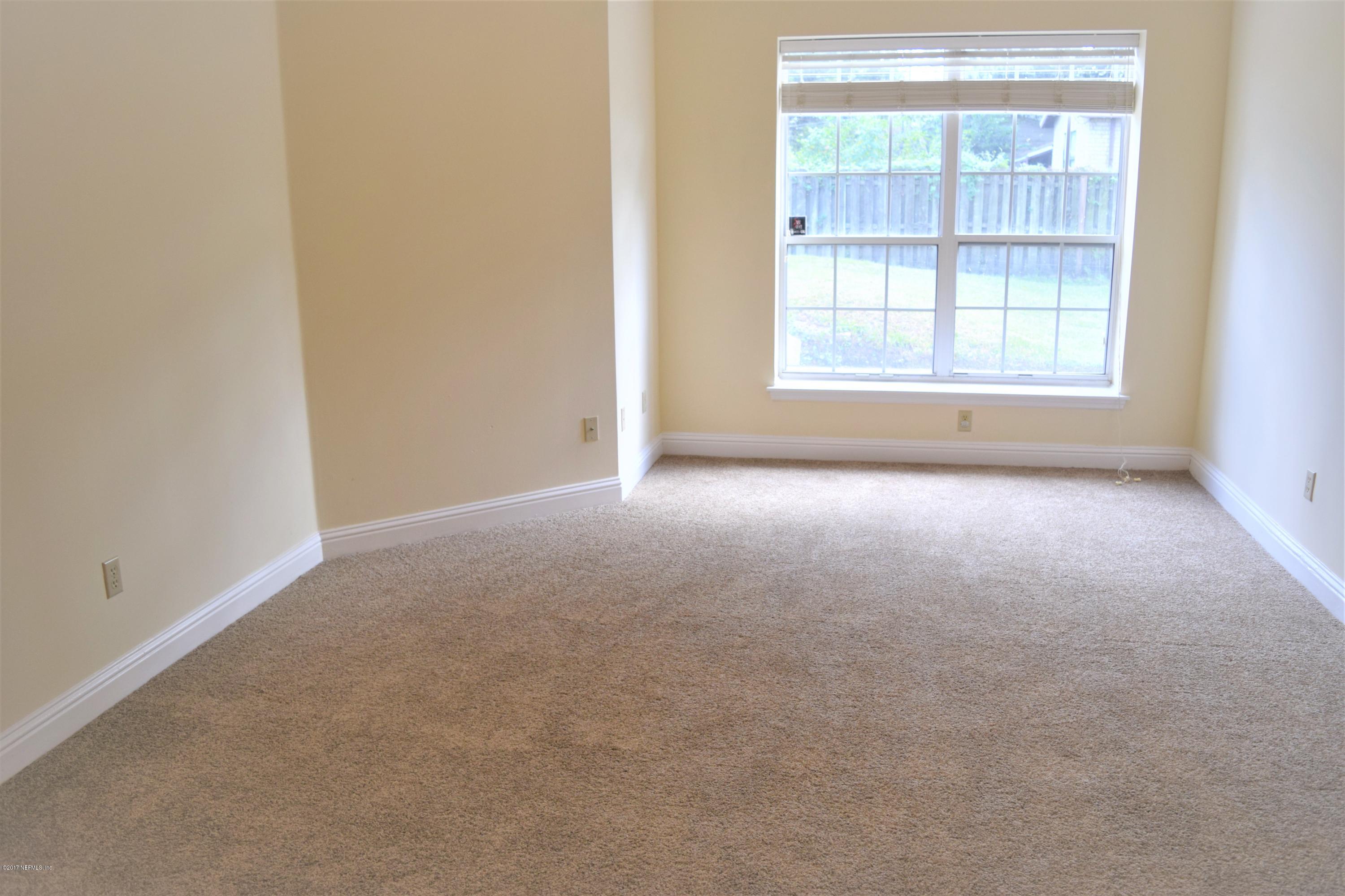 6658 Bennett Road Jacksonville, FL 32216 - Photo 7 of 19 an empty room with a window