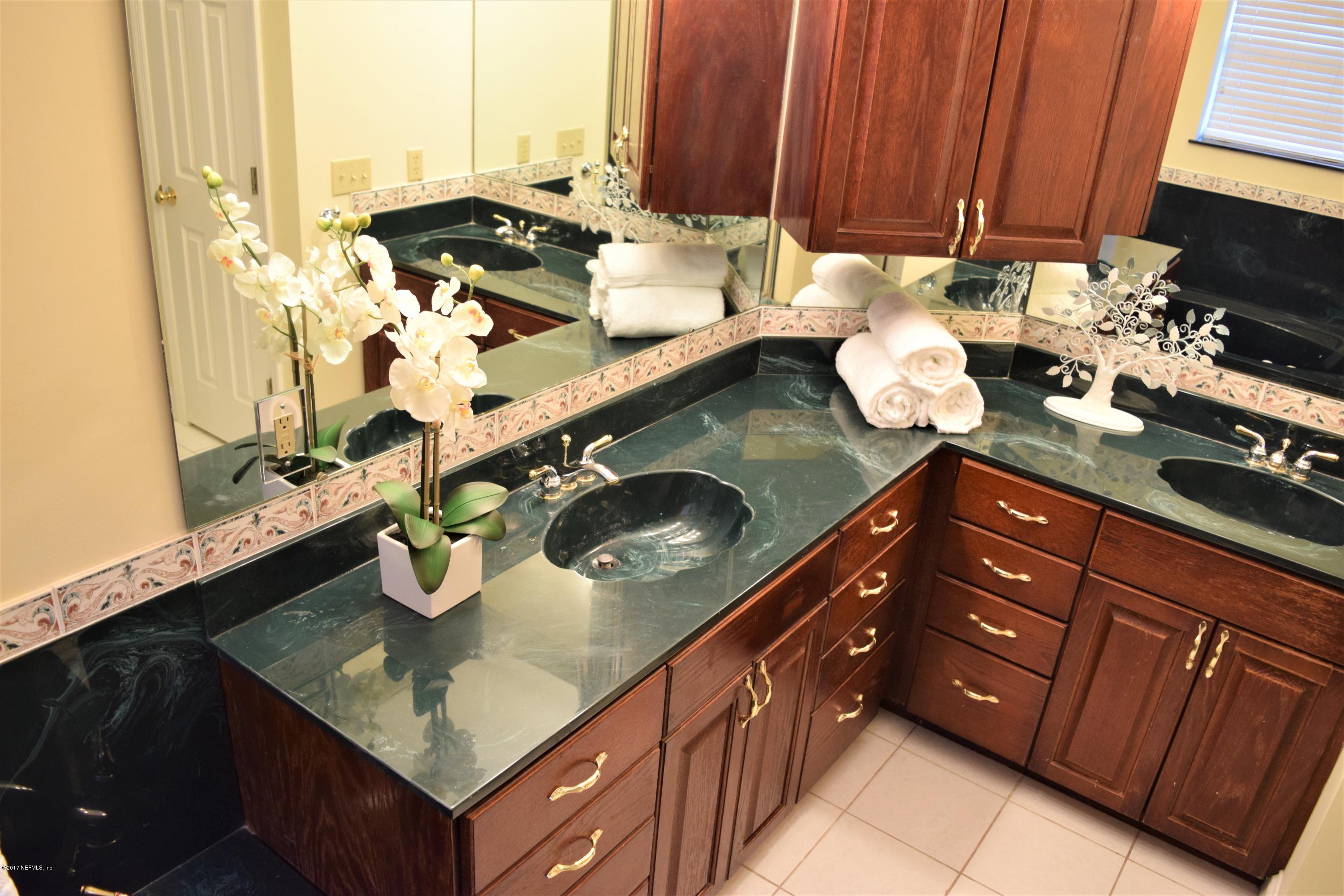 6658 Bennett Road Jacksonville, FL 32216 - Photo 10 of 19 a kitchen with stainless steel appliances granite countertop a sink stove and cabinets