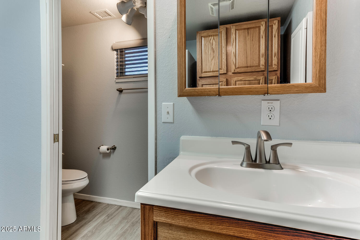17200 West Bell Road, Unit 1801 Surprise, AZ 85374 - Photo 13 of 40 a bathroom with a sink and a toilet