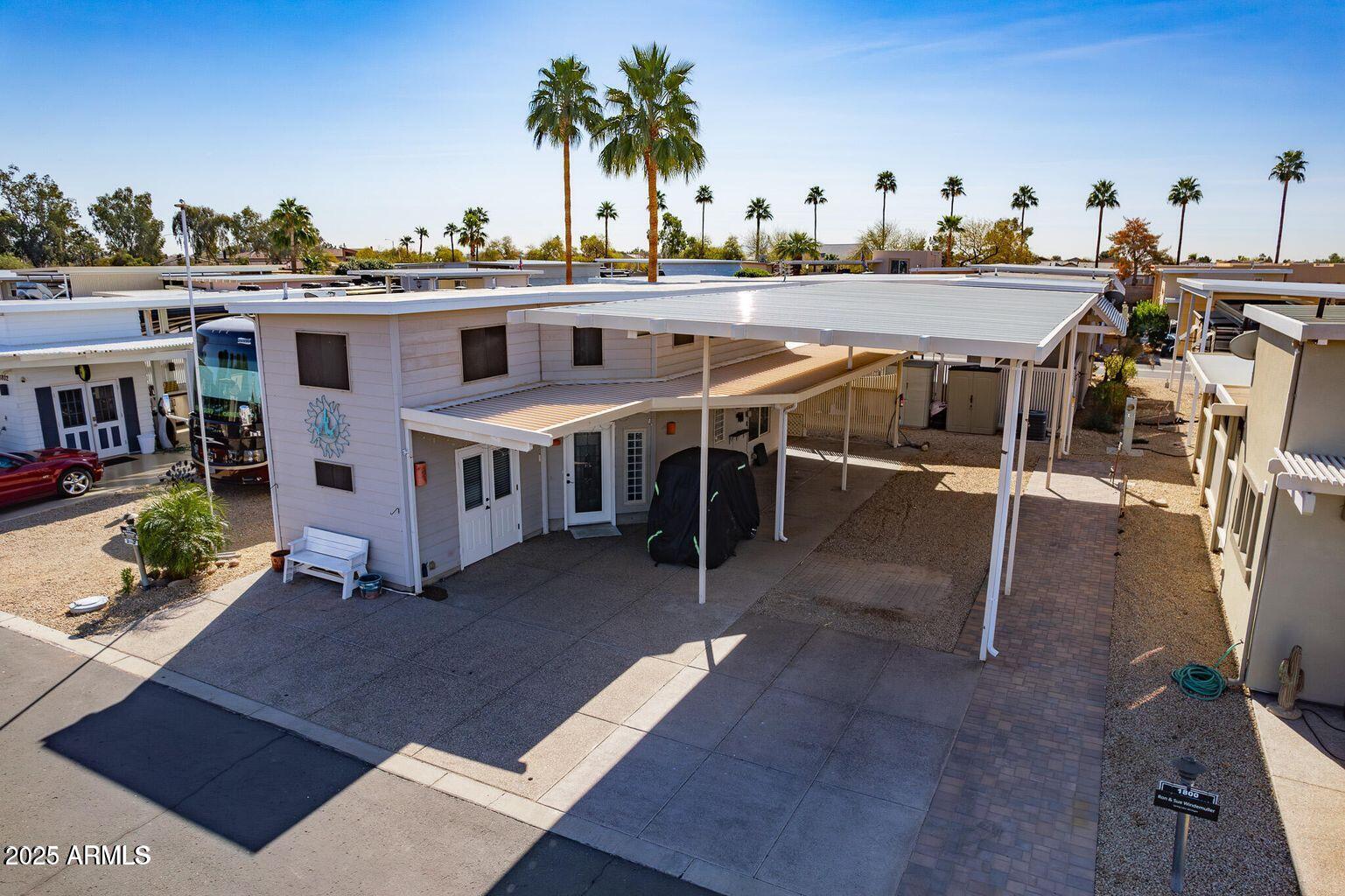 17200 West Bell Road, Unit 1801 Surprise, AZ 85374 - Photo 27 of 40 a view of a chairs and table on the terrace