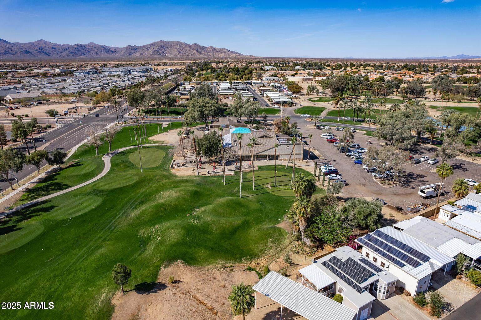 17200 West Bell Road, Unit 1801 Surprise, AZ 85374 - Photo 29 of 40 an aerial view of residential houses with outdoor space and mountain view
