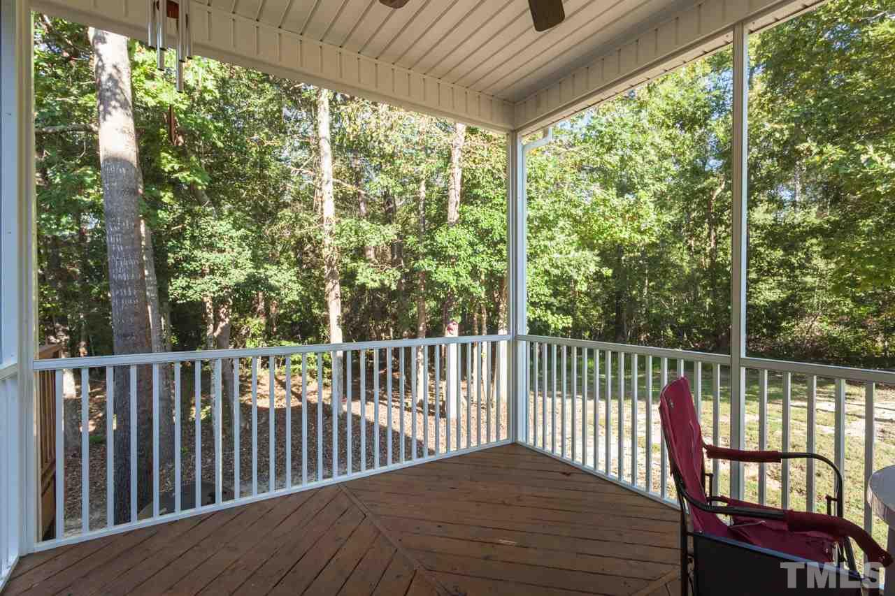 47 High Ridge Court Willow Spring, NC 27592 - Photo 22 of 25 a view of a balcony with wooden floor