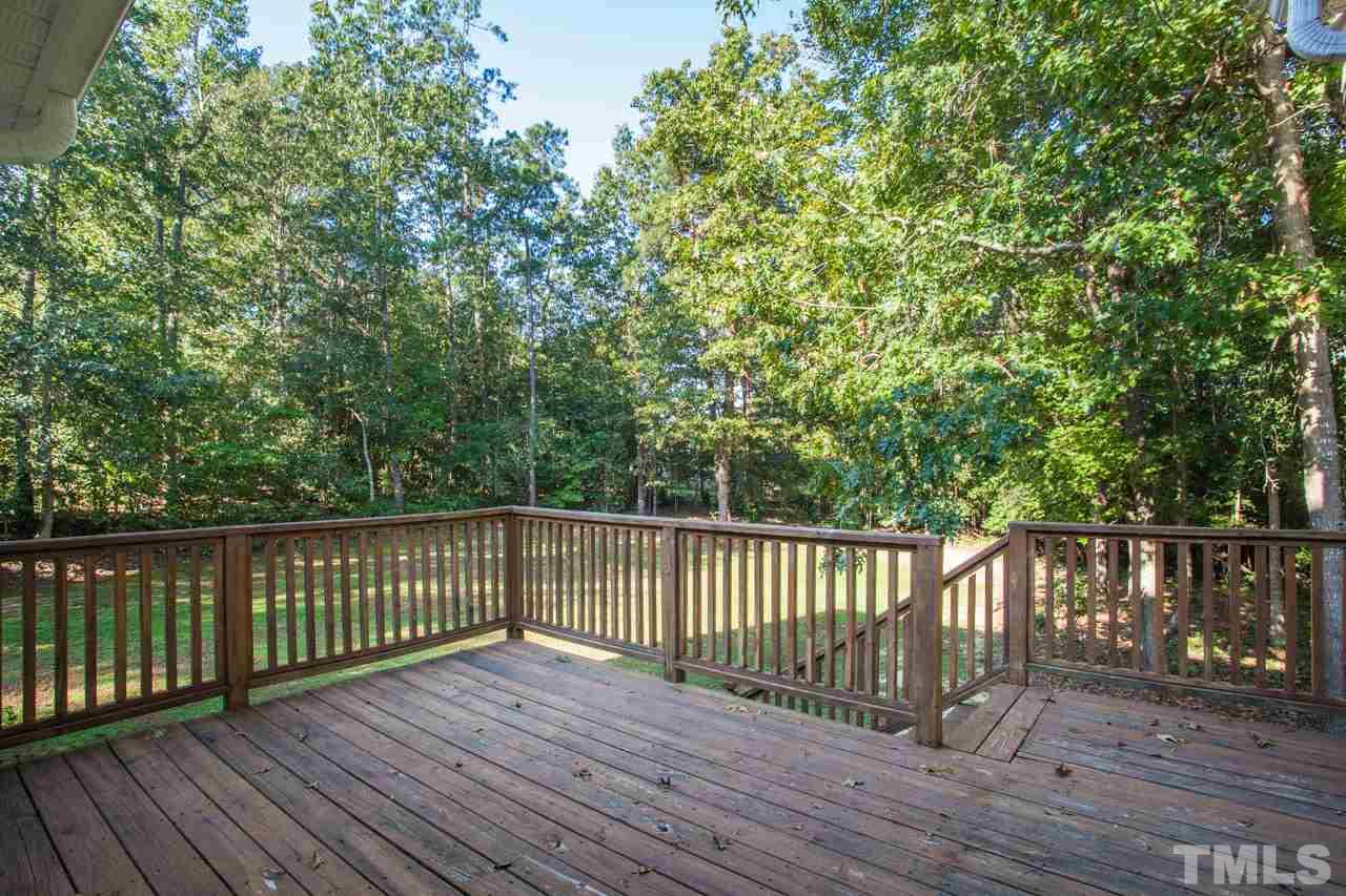 47 High Ridge Court Willow Spring, NC 27592 - Photo 23 of 25 a view of deck with wooden floor and fence