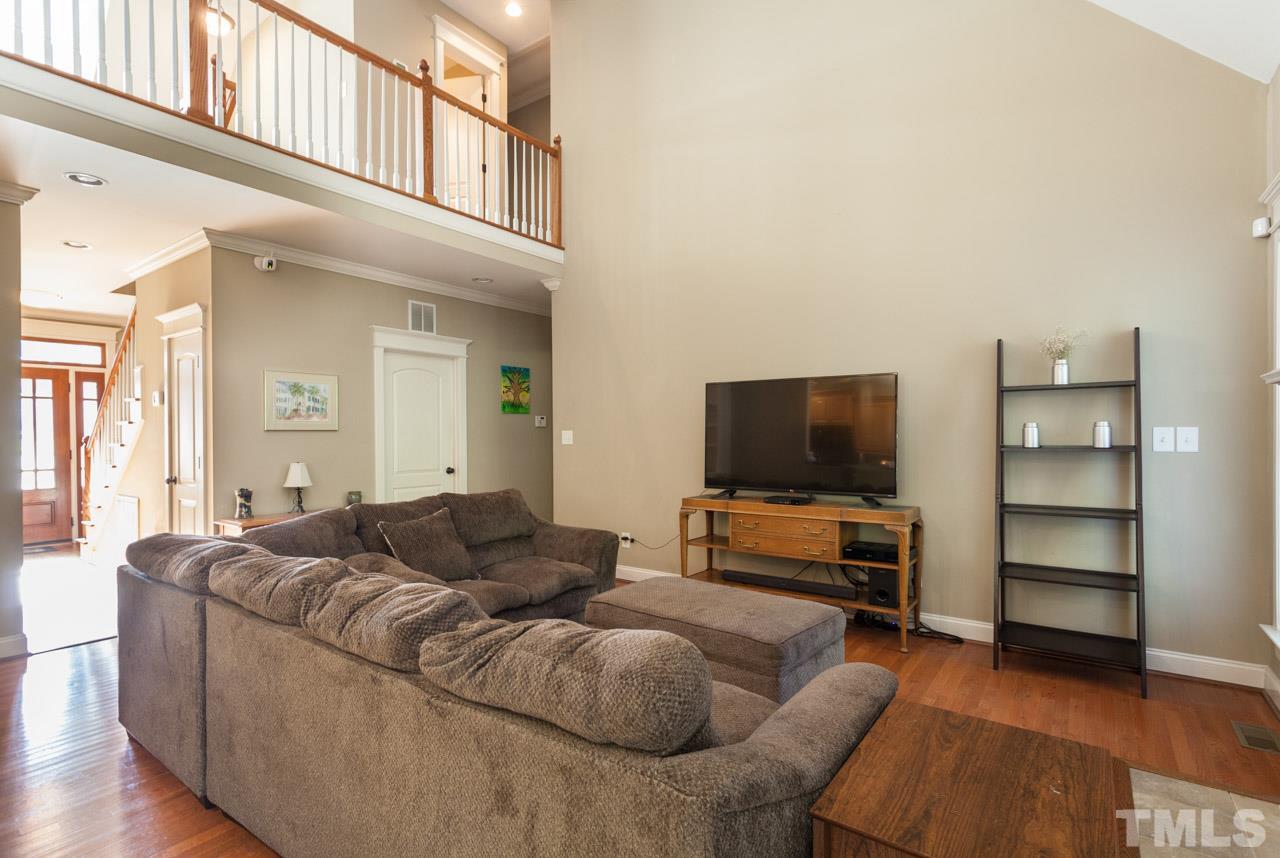 47 High Ridge Court Willow Spring, NC 27592 - Photo 5 of 25 a living room with furniture and a flat screen tv