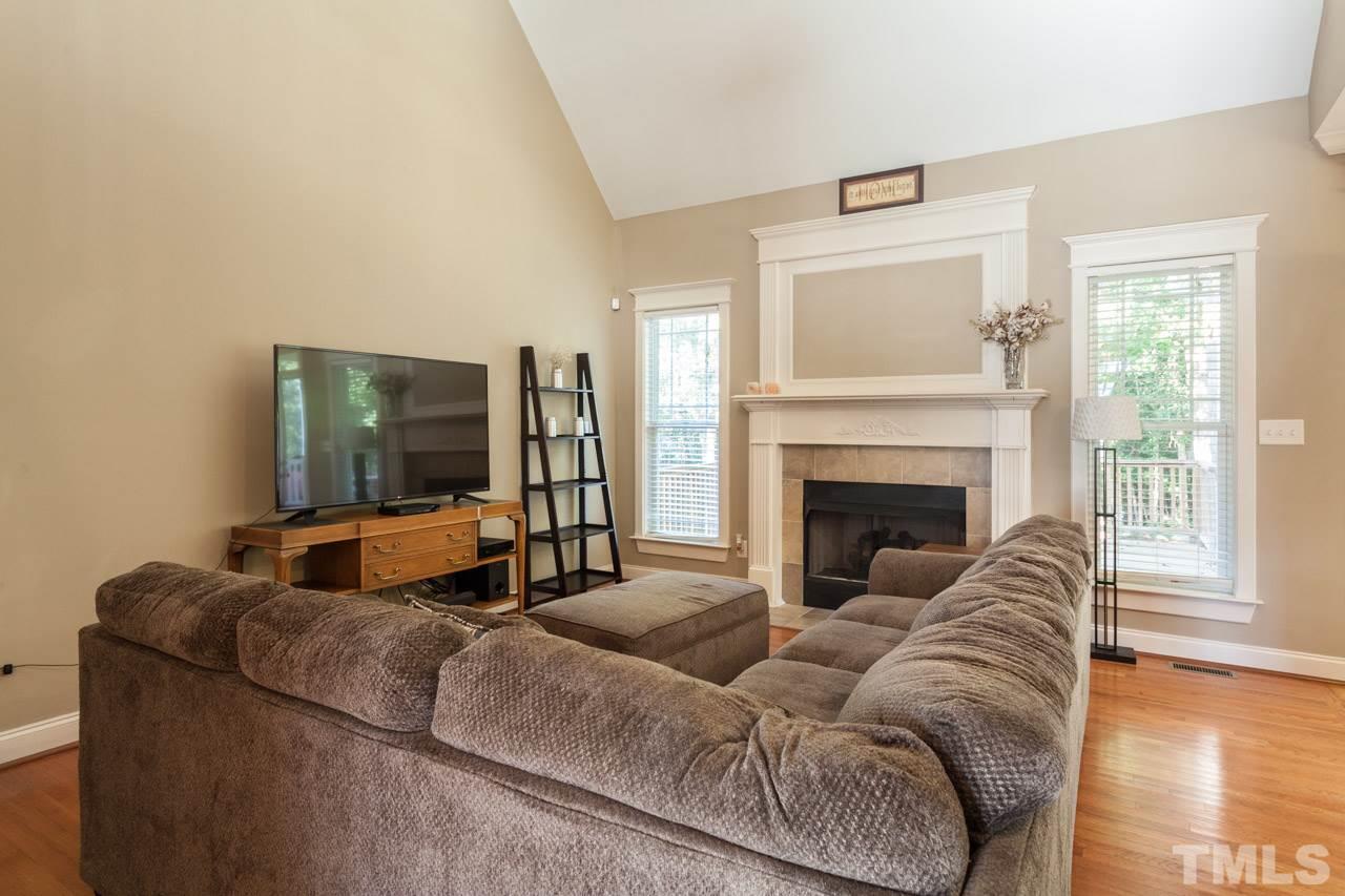 47 High Ridge Court Willow Spring, NC 27592 - Photo 6 of 25 a living room with furniture and a fireplace
