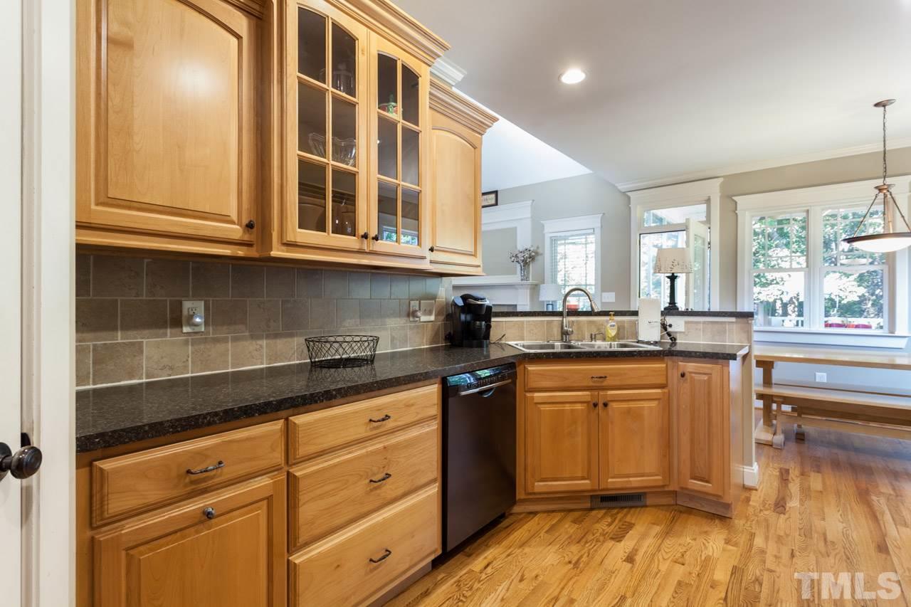 47 High Ridge Court Willow Spring, NC 27592 - Photo 8 of 25 a kitchen with stainless steel appliances granite countertop a sink and cabinets