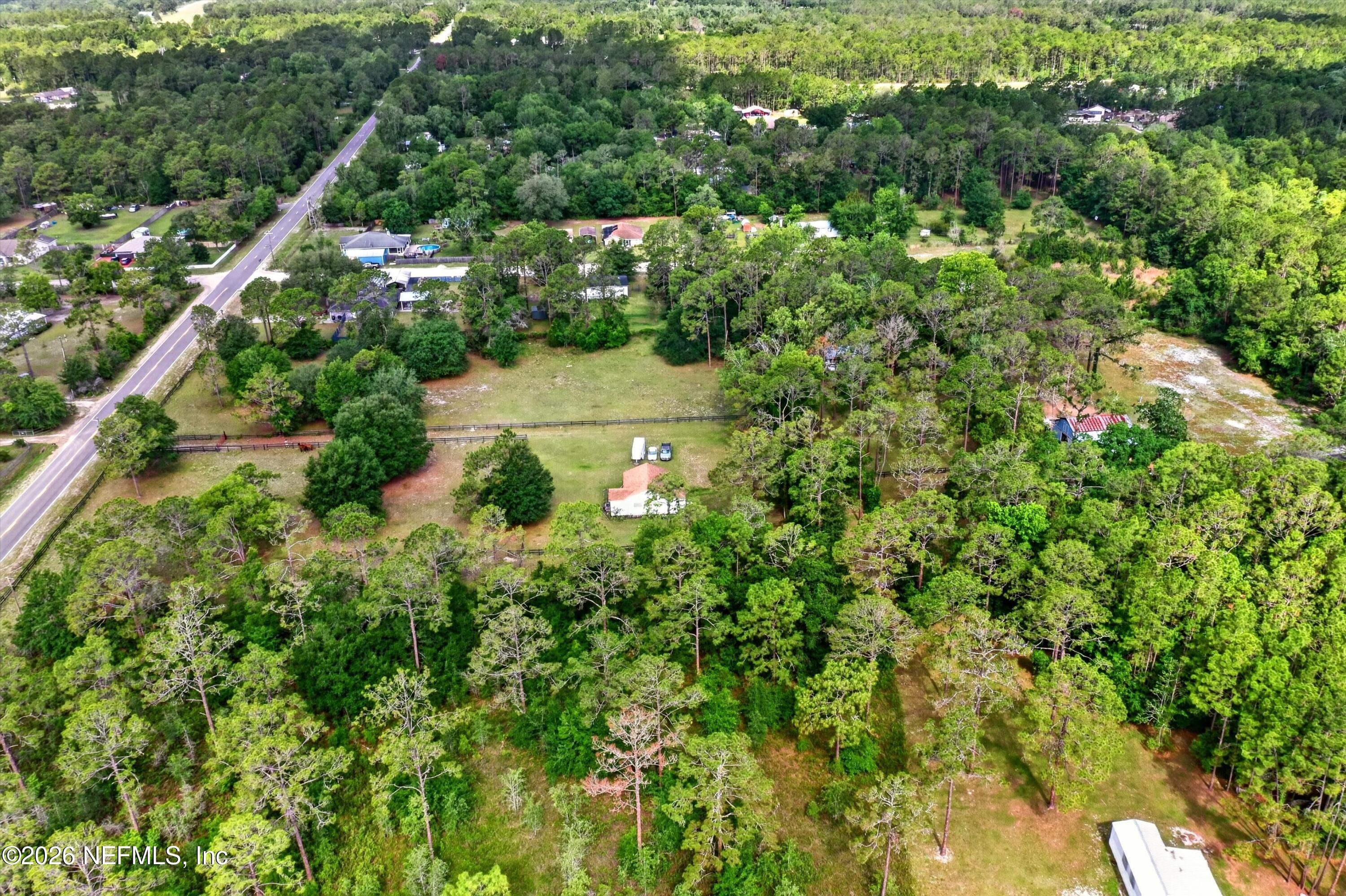 5214 Carter Spencer Road Middleburg, FL 32068 - Photo 40 of 50 an aerial view of residential house with outdoor space and trees all around